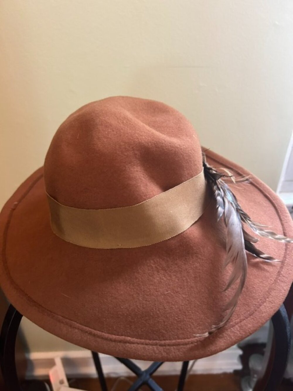United Hatters, Cap and Millinery brown wool hat with feathers